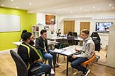 Teacher and two students in discussion